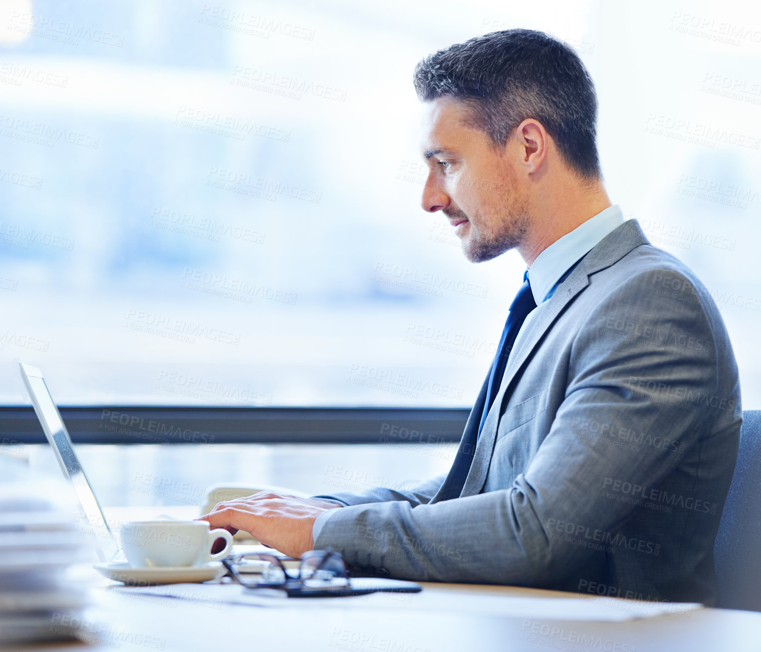 Buy stock photo Profile, businessman and laptop at desk with coffee in office for e-commerce, internet and web development. Corporate, man and startup company in workplace for connectivity, career and legal expert.