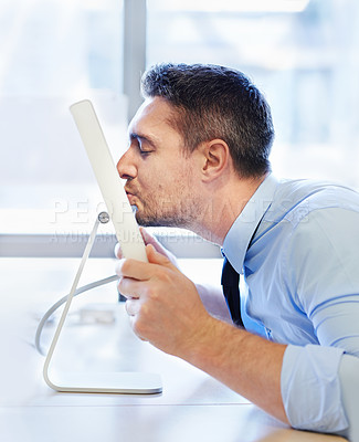 Buy stock photo Happy businessman, kissing screen and office for vocation in career, love for organisation project or crush online. Editor, technology and virtual kisses gesture for affection or appreciation in job
