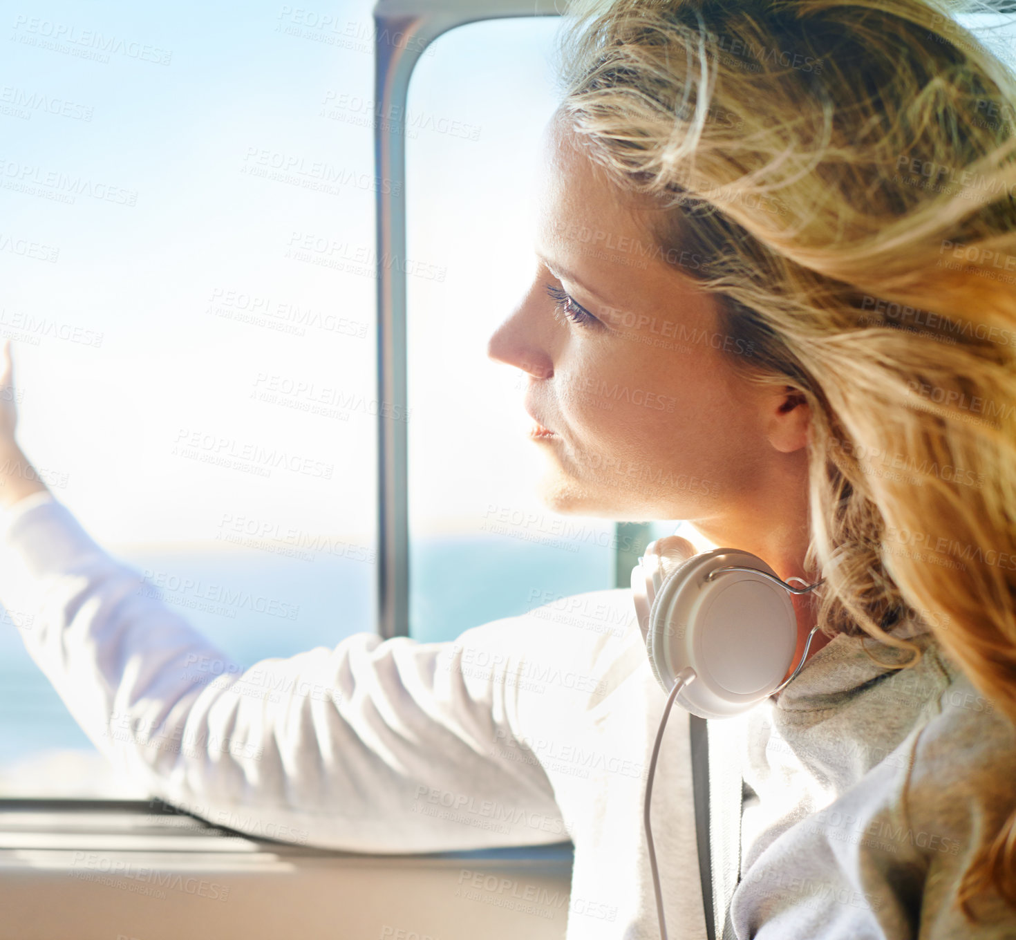 Buy stock photo Woman, relax and road trip with headphones on window open for freedom, travel or summer vacation. Female person, calm and thinking on cruise for exploring, weekend journey and transportation