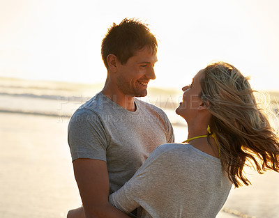 Buy stock photo Love, sunset or happy couple hug at sea on holiday, vacation or anniversary romance in summer. Travel, smile and people on date at beach, nature or ocean for bonding, support and honeymoon in Hawaii