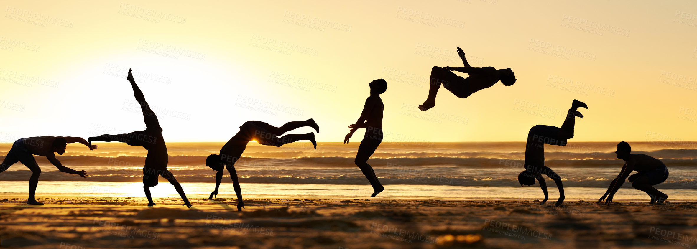 Buy stock photo Multi shot of a man doing flips on the beach front 