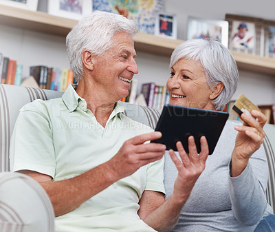 Buy stock photo Senior couple, tablet and credit card for online shopping on living room sofa together at home. Happy elderly man and woman smiling on technology for ecommerce, banking app or payment on lounge couch