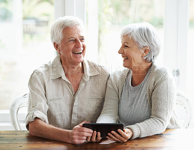 Buy stock photo Tablet, senior couple and laughing in home on social media, funny news and online meme. Happy old man, woman and relax with digital technology, subscription and streaming comedy on network connection