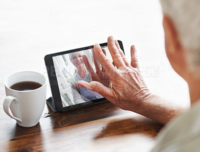 Buy stock photo A senior woman having a video chat with her husband on a digital tablet