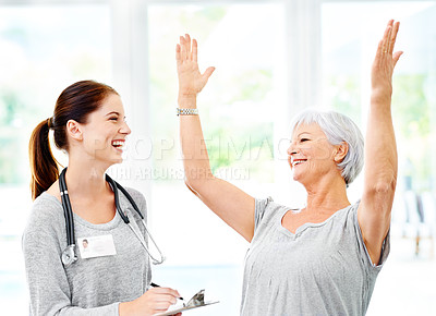 Buy stock photo Happy, celebration and senior woman with doctor in home to check results of health with surprise. Healthy, patient and therapist in elderly care with news, info or healing hypertension blood pressure
