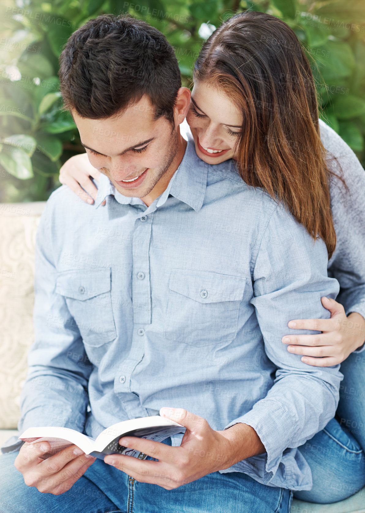 Buy stock photo Couple, reading book and love outdoor on bench for relationship bonding, honeymoon and relax in nature. Woman, man and happiness together with story for summer time, smile and romantic date in park