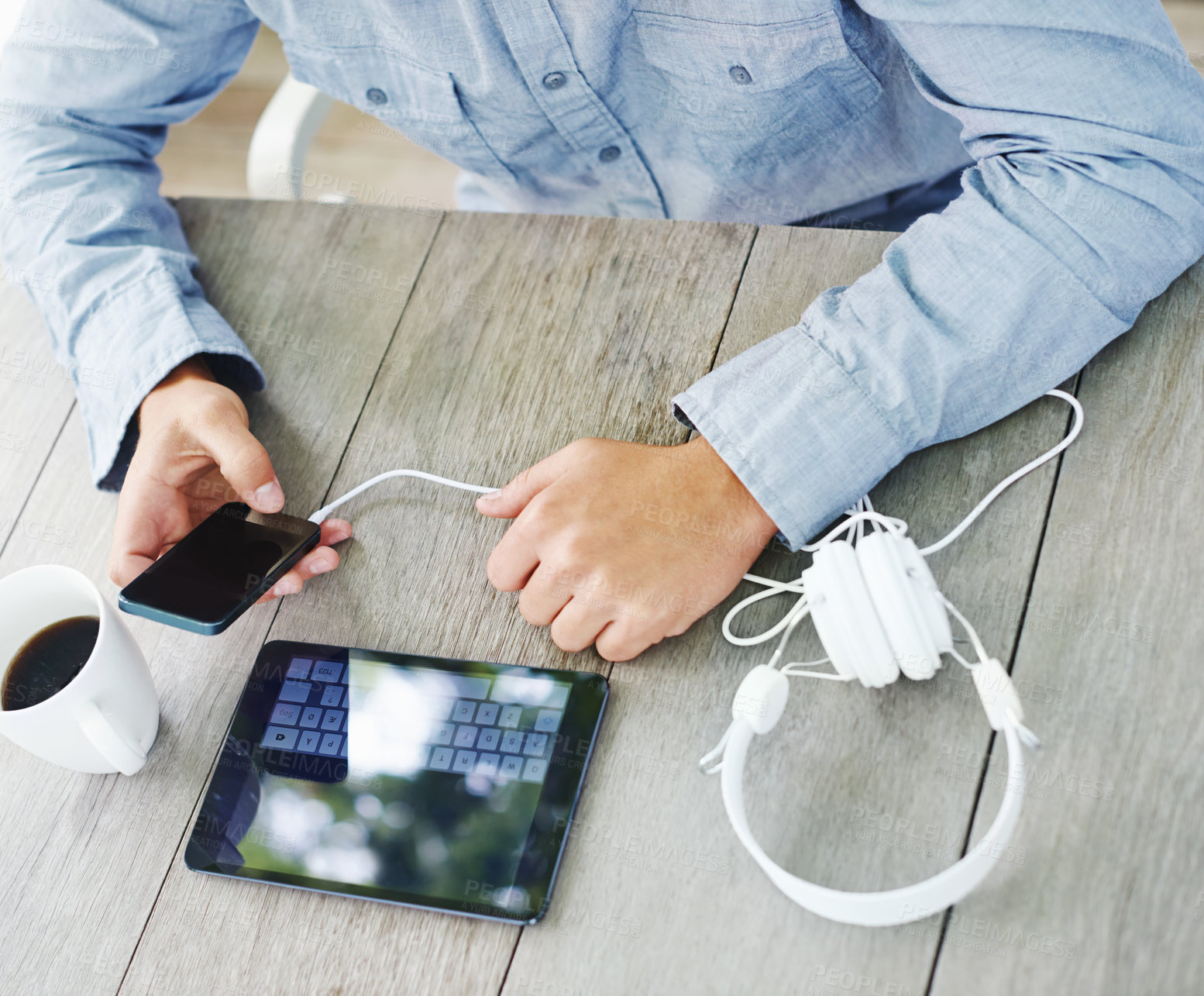 Buy stock photo Cropped view of a man's hands using digital devices