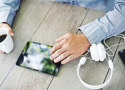 Buy stock photo Table, coffee and hand with typing on tablet for communication, social media or online search. High angle, morning and man with digital technology on desk for text message, networking or connectivity