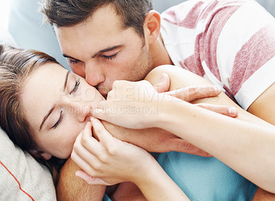 Buy stock photo Kiss, couple or hug while sleeping on sofa with love, safety or protection, rest or calm bonding at home. Sleep, security or people in living room for quiet snooze, peace or relax on weekend in house