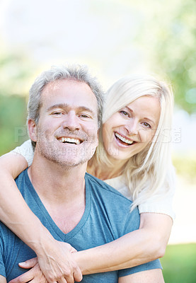 Buy stock photo A happy mature couple enjoying a day out together in the park