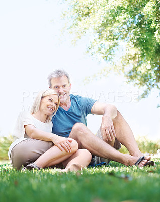 Buy stock photo Happy, relax and senior couple in park for bonding, relationship and commitment outdoors on weekend. Portrait, retirement and mature man and woman embrace for romance, love and marriage in nature