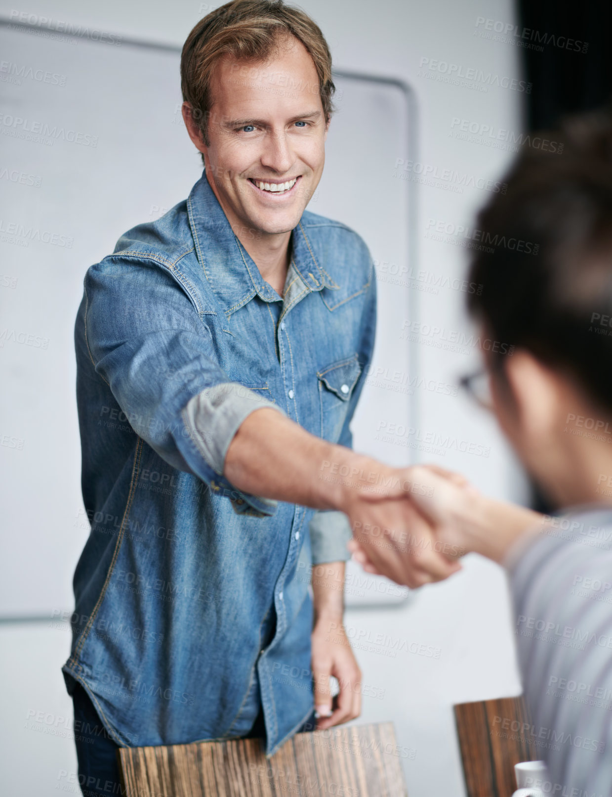 Buy stock photo Happy man, handshake and meeting with colleague for greeting, partnership or agreement at office. Male person or employee shaking hands for interview, deal or collaboration in teamwork at workplace