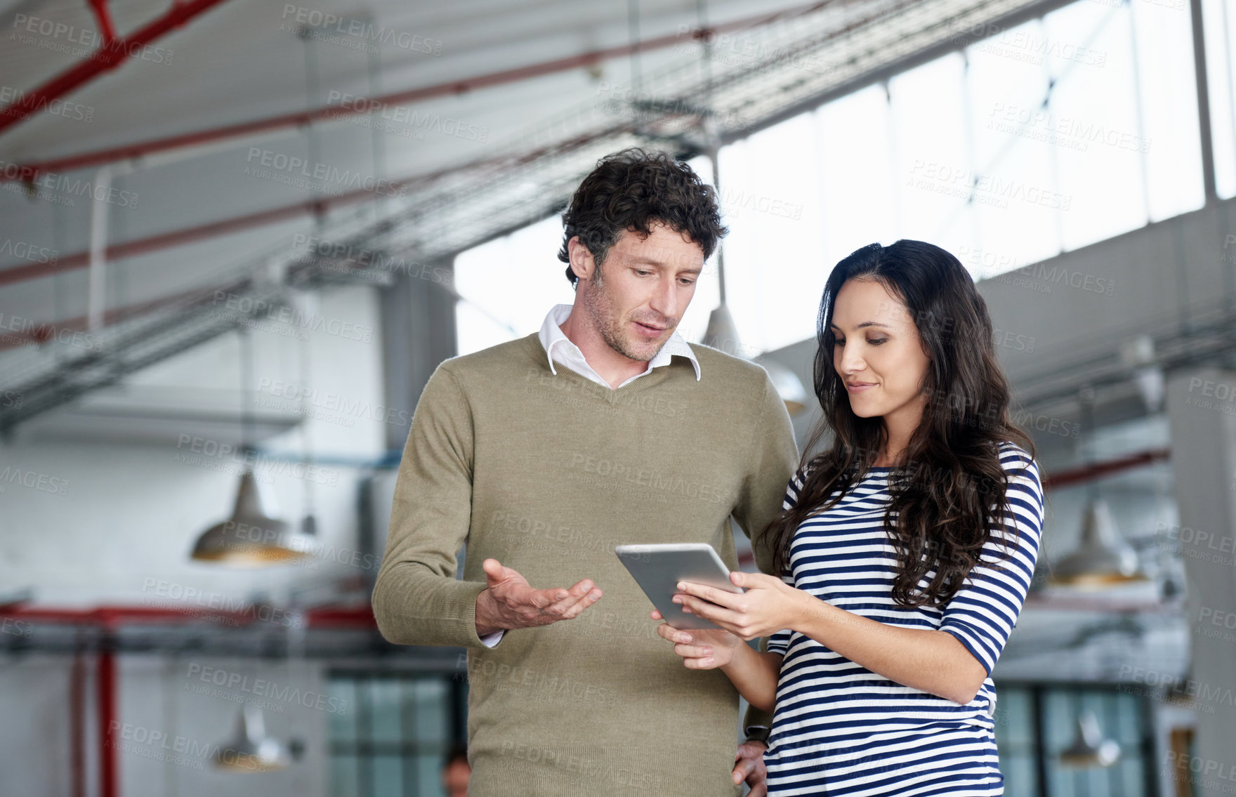 Buy stock photo Tablet, employees and man with woman, office and conversation for news online, reading and creative for job. Collaboration, partnership and coworking in workplace, internet and business for design