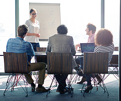 Buy stock photo Shot of a group of coworkers sitting in on a presentation in a boardroom