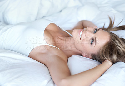 Buy stock photo Happy, portrait and smile of a woman in bedroom, wake up and rest in the morning at home. Sleeping, relaxation and calm female person from New York with duvet, comfort and room or modern apartment