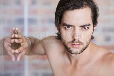 Buy stock photo Skincare, serious and portrait of man with confidence for treatment, shine and glow on face. Male person, beard and relax with pride by brick wall for apartment, wellness and topless by mirror