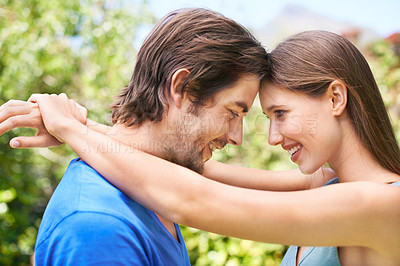 Buy stock photo Couple, admiration and nature together for relationship, bonding love and caring look or outside date for romance. Blue sky, trees and summer holiday, happy and smile for quality time with partner