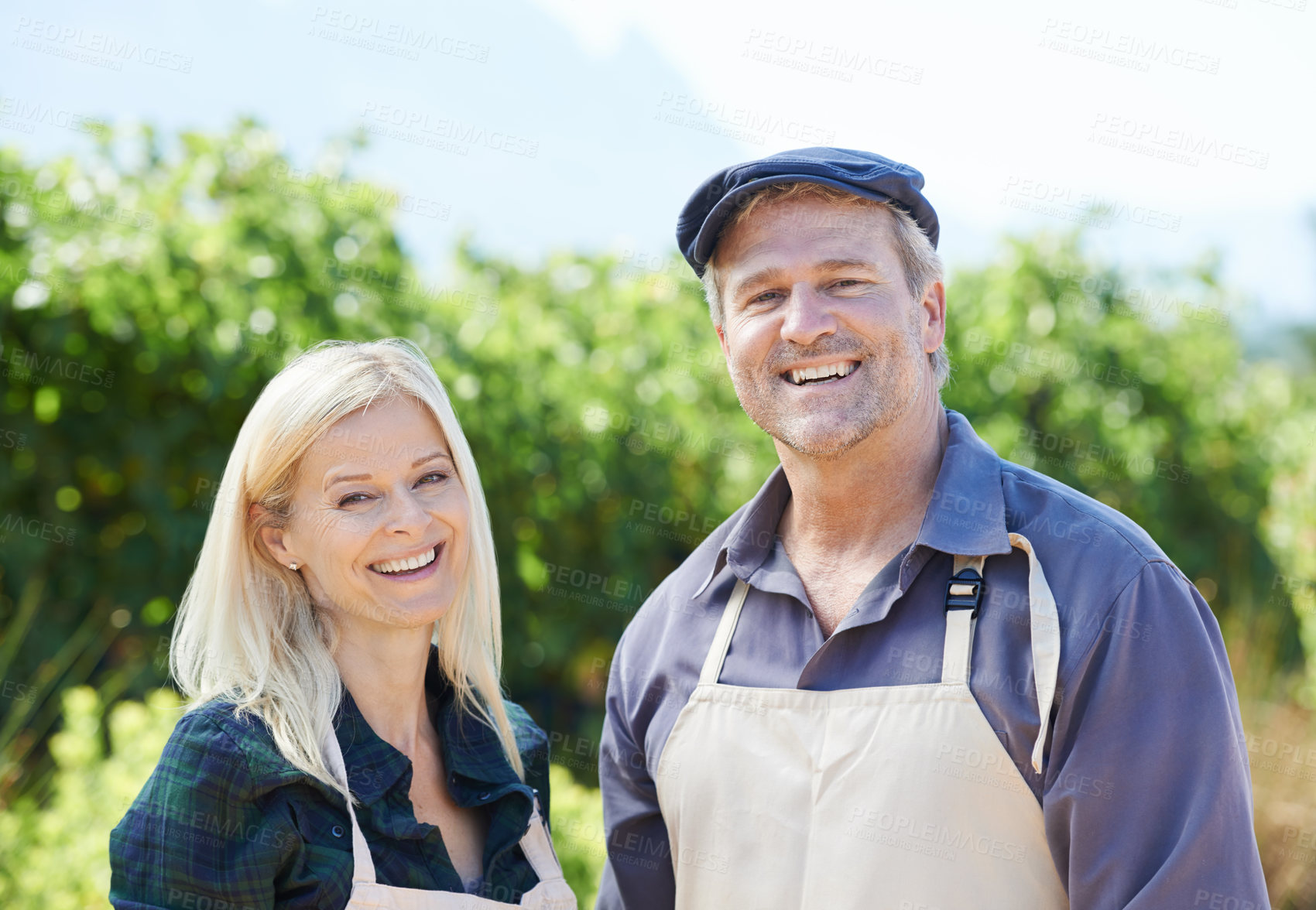 Buy stock photo Farming, portrait or happy couple with apron, smile and partnership in small business, growth or market. Team, man and woman with confidence for industry, owner and entrepreneur in career of farmers