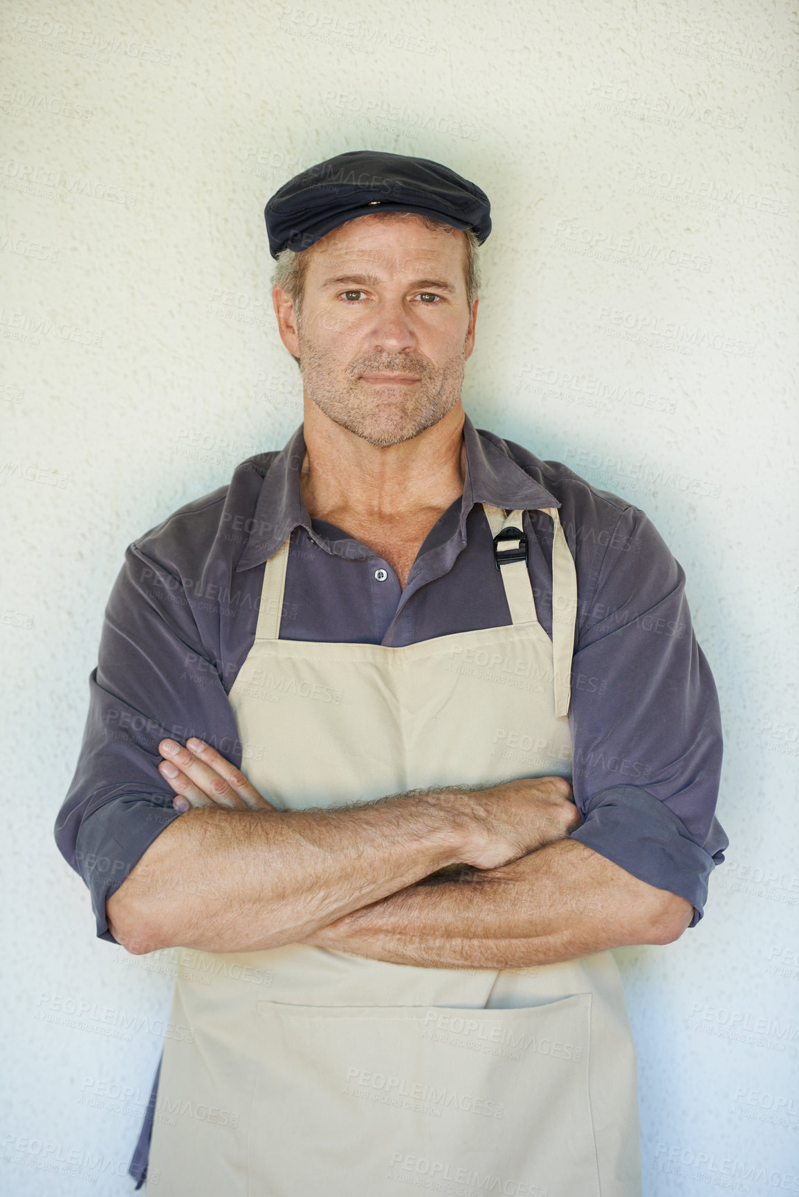 Buy stock photo Man, farmer or apron with arms crossed on backdrop for career, natural product for export. Male entrepreneur, wall background or confidence in portrait for agriculture, sustainable business in France