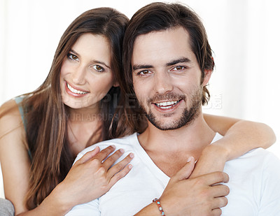 Buy stock photo Smile, embrace and portrait of couple in studio together with romance, commitment and marriage support. Love, man and happy woman hug with relationship trust, care and partnership on white background