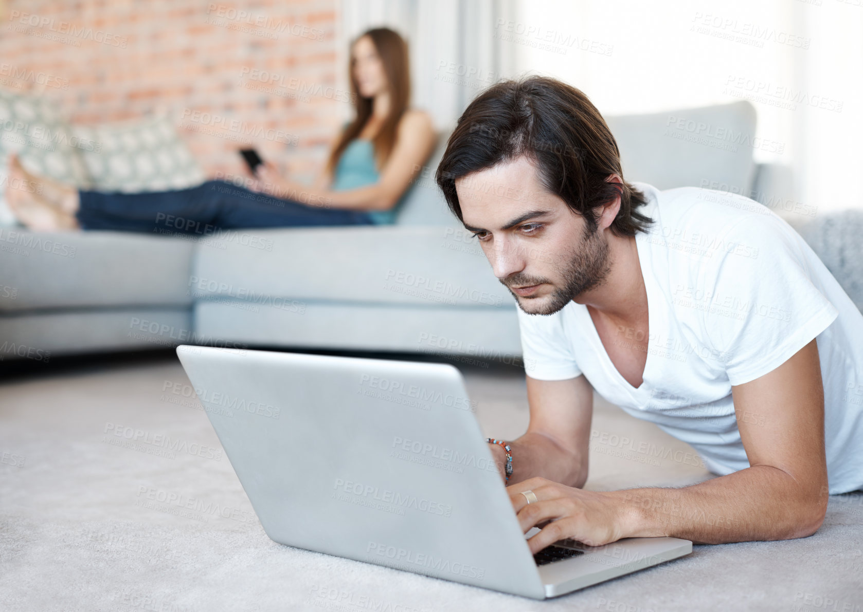 Buy stock photo Home, laptop and man on floor, typing and connection with internet, website information and online reading. Person, apartment and guy with pc, research and relaxing with computer and digital game