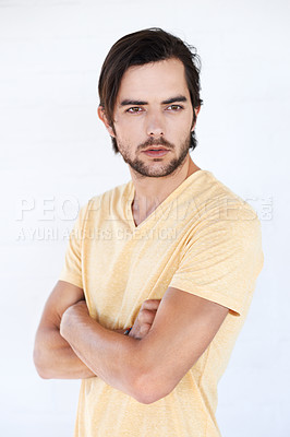 Buy stock photo Man, vertical and thinking with casual fashion and arms crossed with isolated white background. Studio, person and adult with tshirt and beard feeling calm and relax think and standing with mockup
