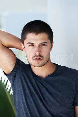 Buy stock photo Confidence, serious and portrait of a man in home for relaxing, chill and pride in apartment. Sexy, flirting and face closeup of person with confident attitude, attractive and handsome in house