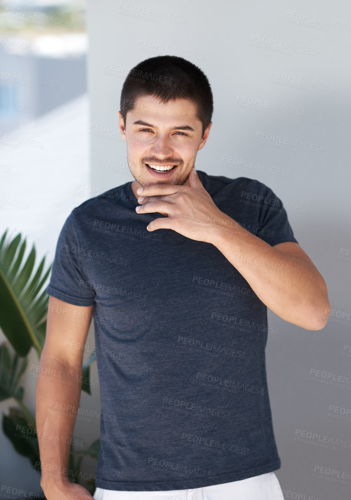 Buy stock photo Happy, portrait and confident man with student clothes, style and modern house with white wall and casual fashion. Smile, calm and cool clothing in a home with trendy and relaxed male tshirt