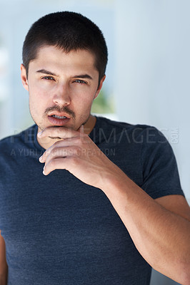 Buy stock photo Confidence, serious and portrait of a man in home for relaxing, chill and pride in apartment. Sexy, flirting and face closeup of person with confident attitude, attractive and handsome in house