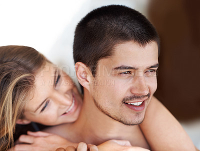 Buy stock photo Attractive young woman embracing her partner with a smile