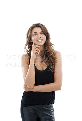 Buy stock photo Gorgeous young woman smiling while looking thoughtful and isolated on white