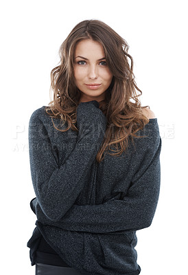 Buy stock photo Portrait of a cute sensual woman isolated on a white studio background. Young brunette model wrapped in charcoal sweater looking cozy. Fashion model with curly hair and clear skin promoting skincare