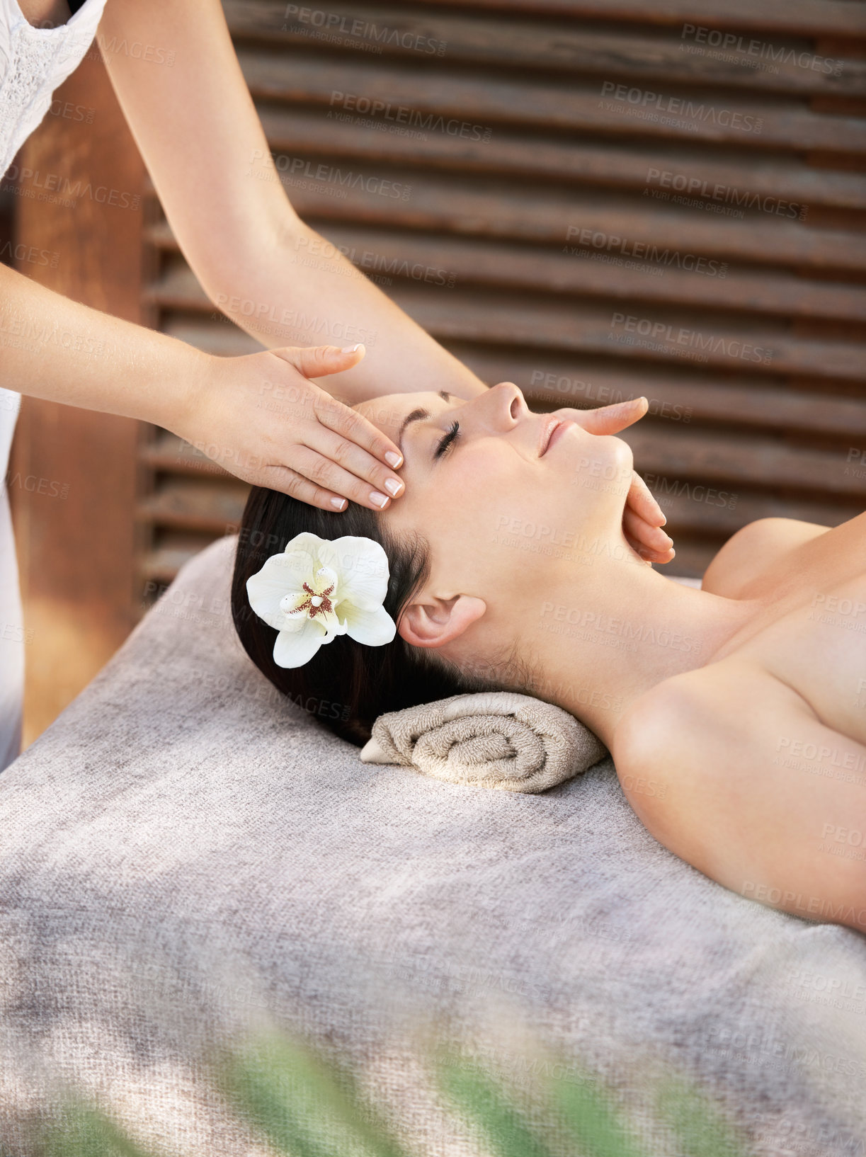 Buy stock photo Woman, customer or hands for facial massage, peace and wellness for outdoor skincare treatment. Calm person, masseuse and sleeping for therapy, holistic healing and service at hotel or beauty spa