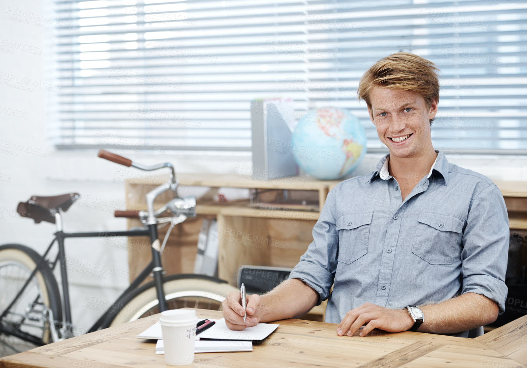 Buy stock photo Smile, portrait and man writing in notebook in office, designer or research information of creative drawing for project. Happy, male person and developer planning, artistic and startup proposal idea