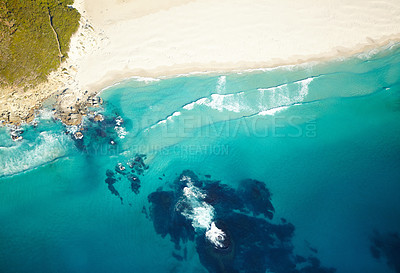 Buy stock photo Aerial shot of a secluded beach and it's turquoise water