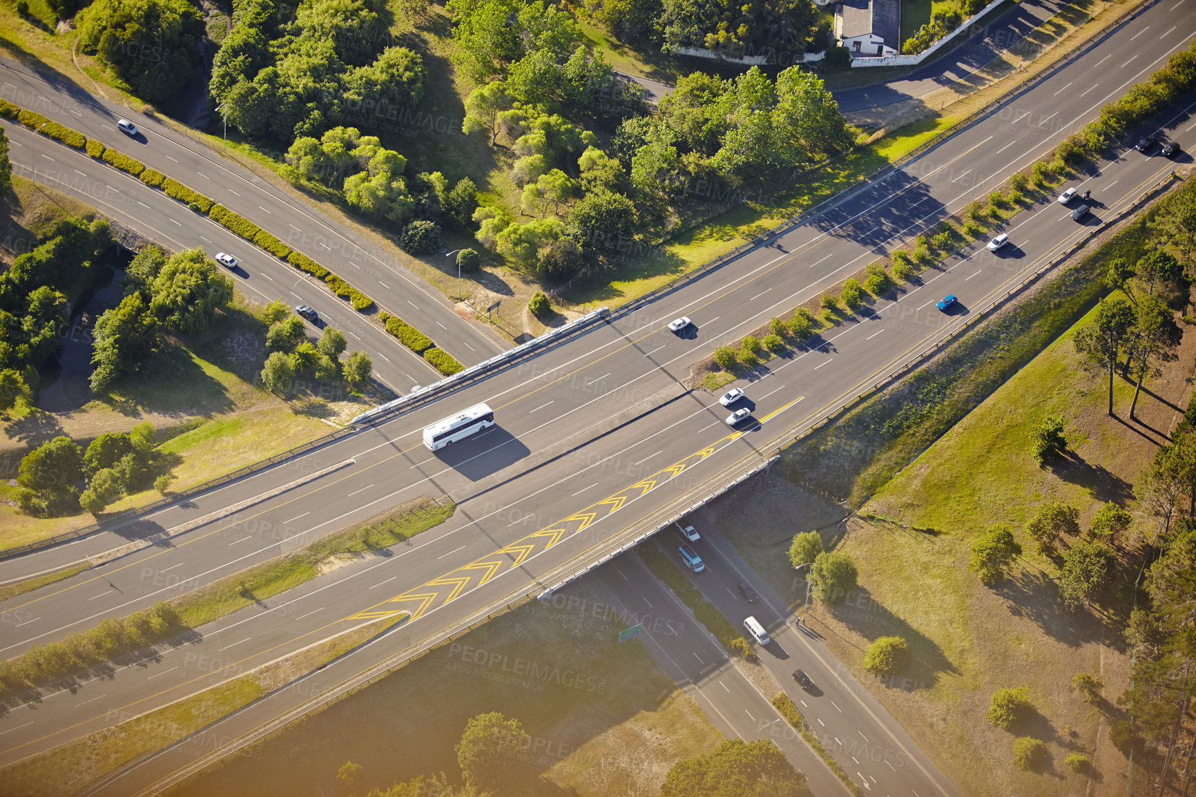 Buy stock photo Aerial highway, travel and cars on road with landscape for satellite image, nature and sunshine in city. Transport, street connection and bridge infrastructure for overpass, trees and map in Brazil