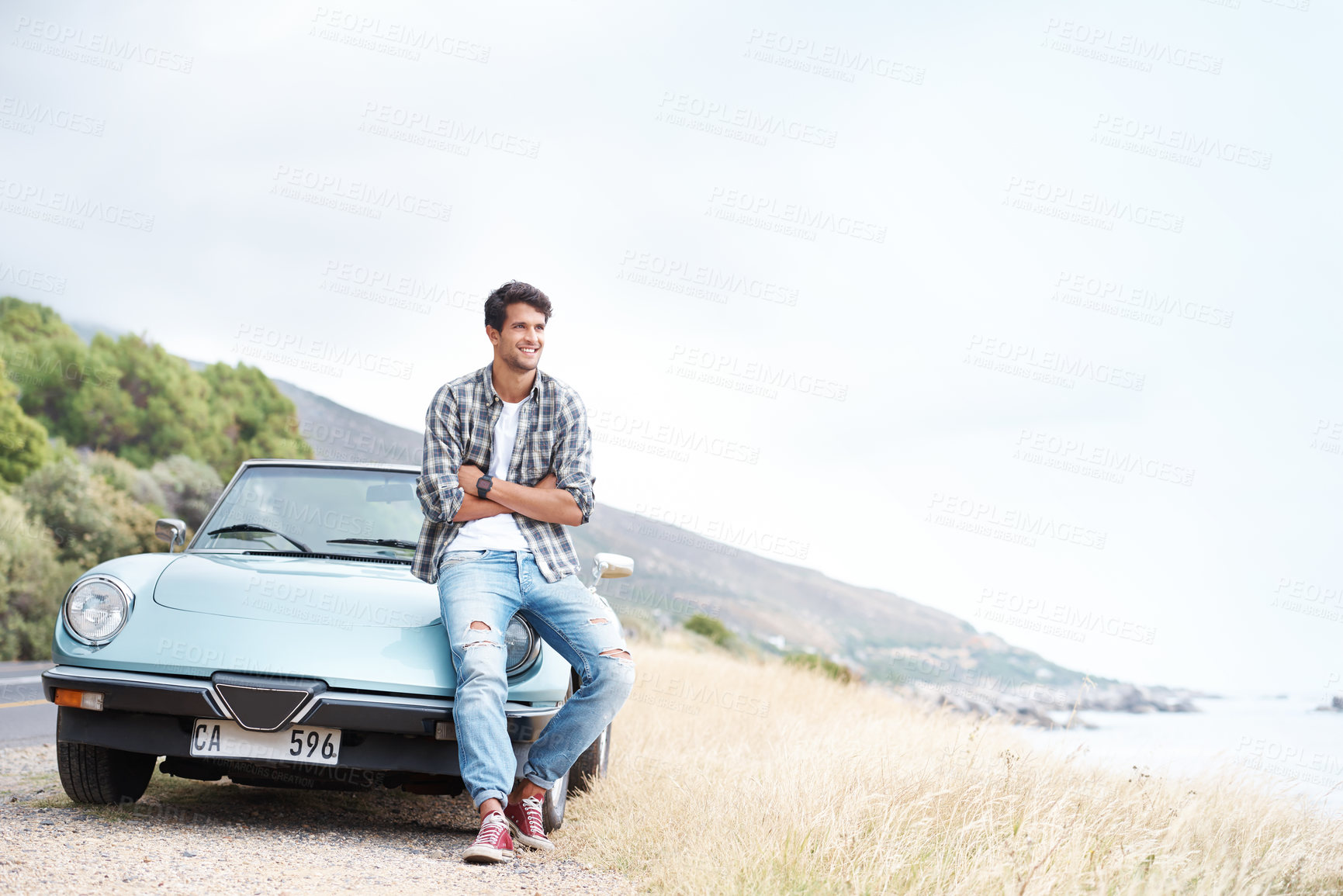 Buy stock photo Thinking, car and man on road trip for holiday, travel or summer vacation outdoor in Italy. Transport, view and smile of confident person with arms crossed for adventure, mockup and space on journey