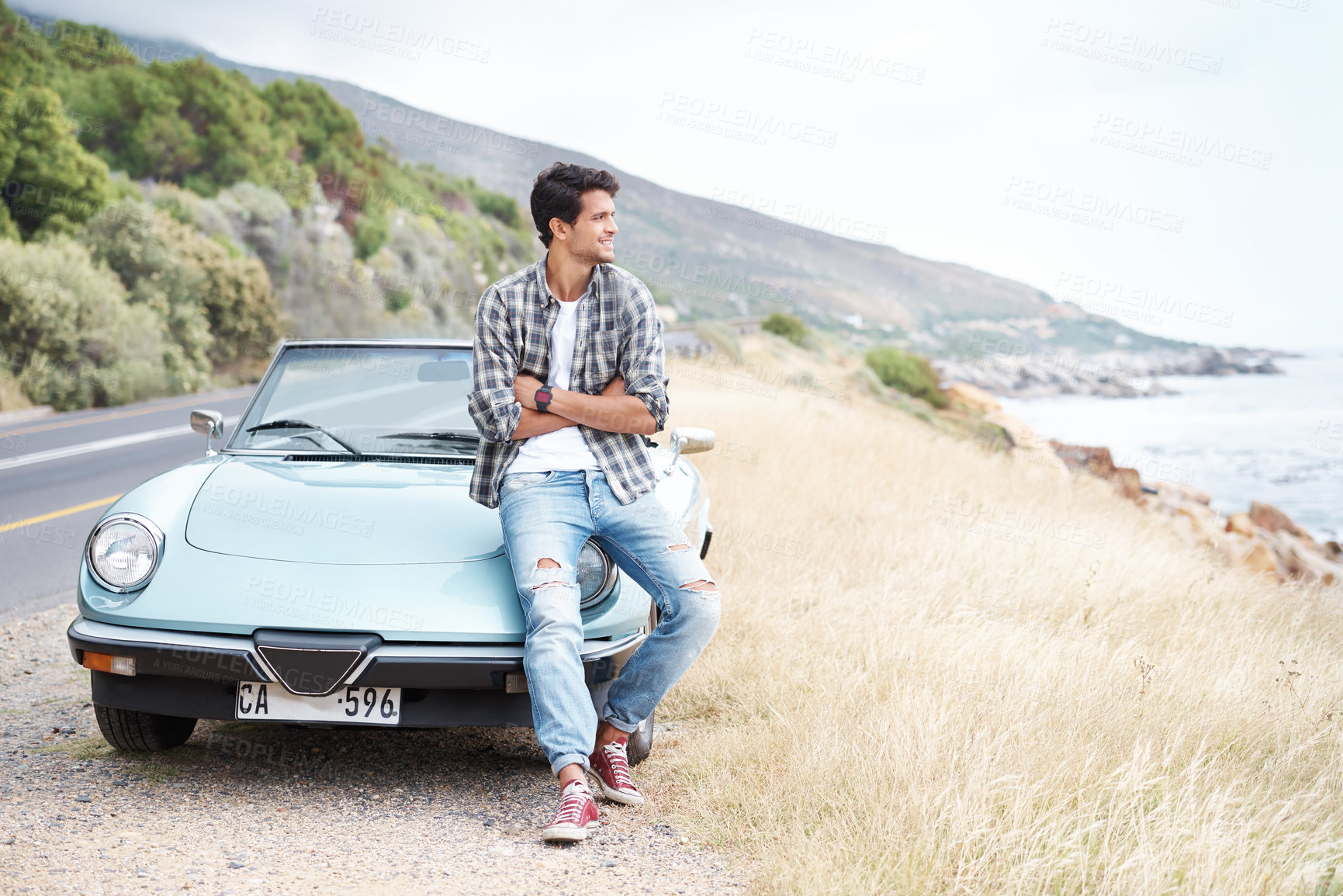 Buy stock photo Thinking, car and man on road trip for vacation, travel or summer holiday outdoor in Spain. Transport, view and smile of confident person with arms crossed for adventure, dream and journey by sea