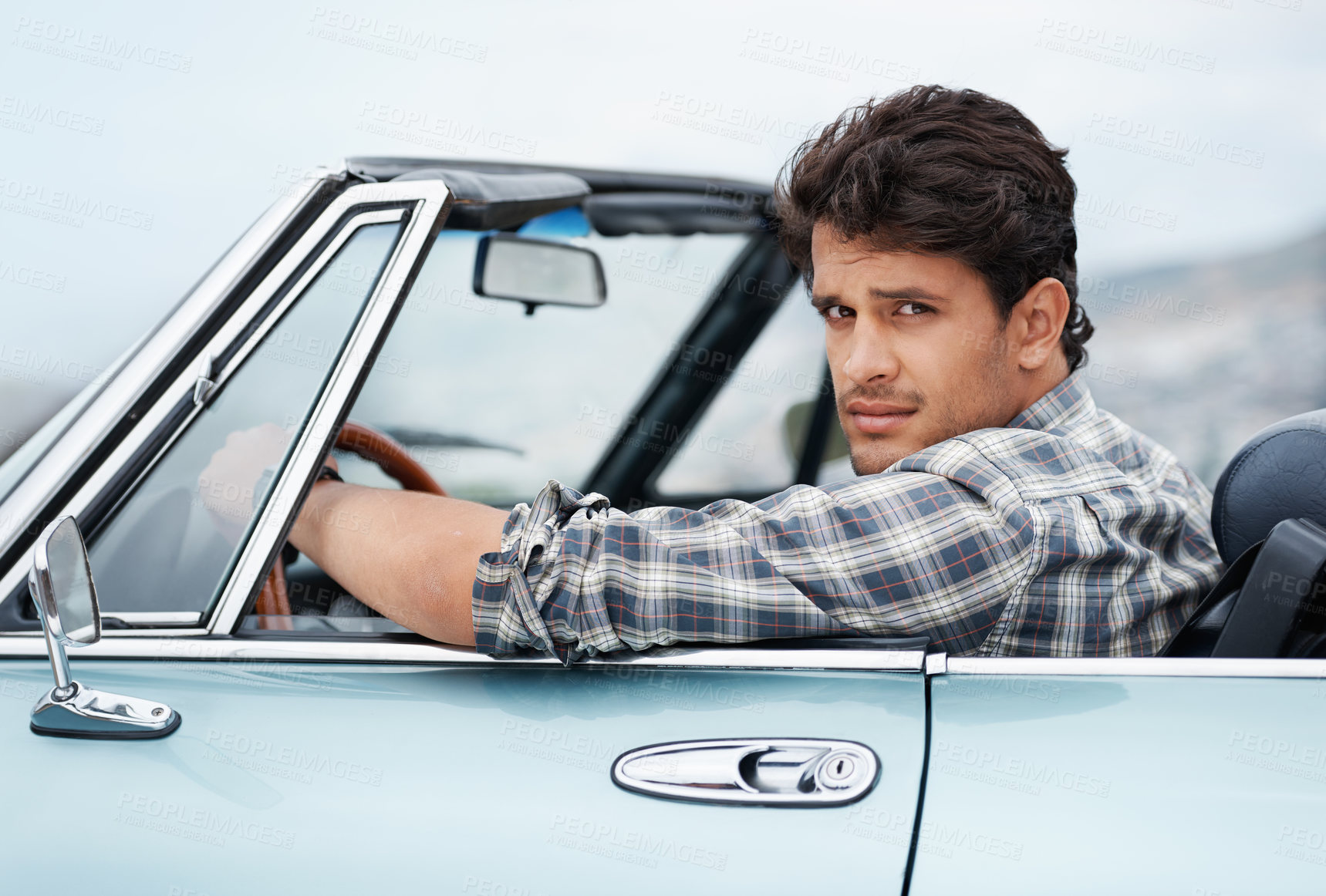 Buy stock photo Man, portrait and road trip in car for travel, drive and journey with explore, adventure or vacation. Driver, serious and face in convertible with driving for crazy summer, holiday or freedom outdoor