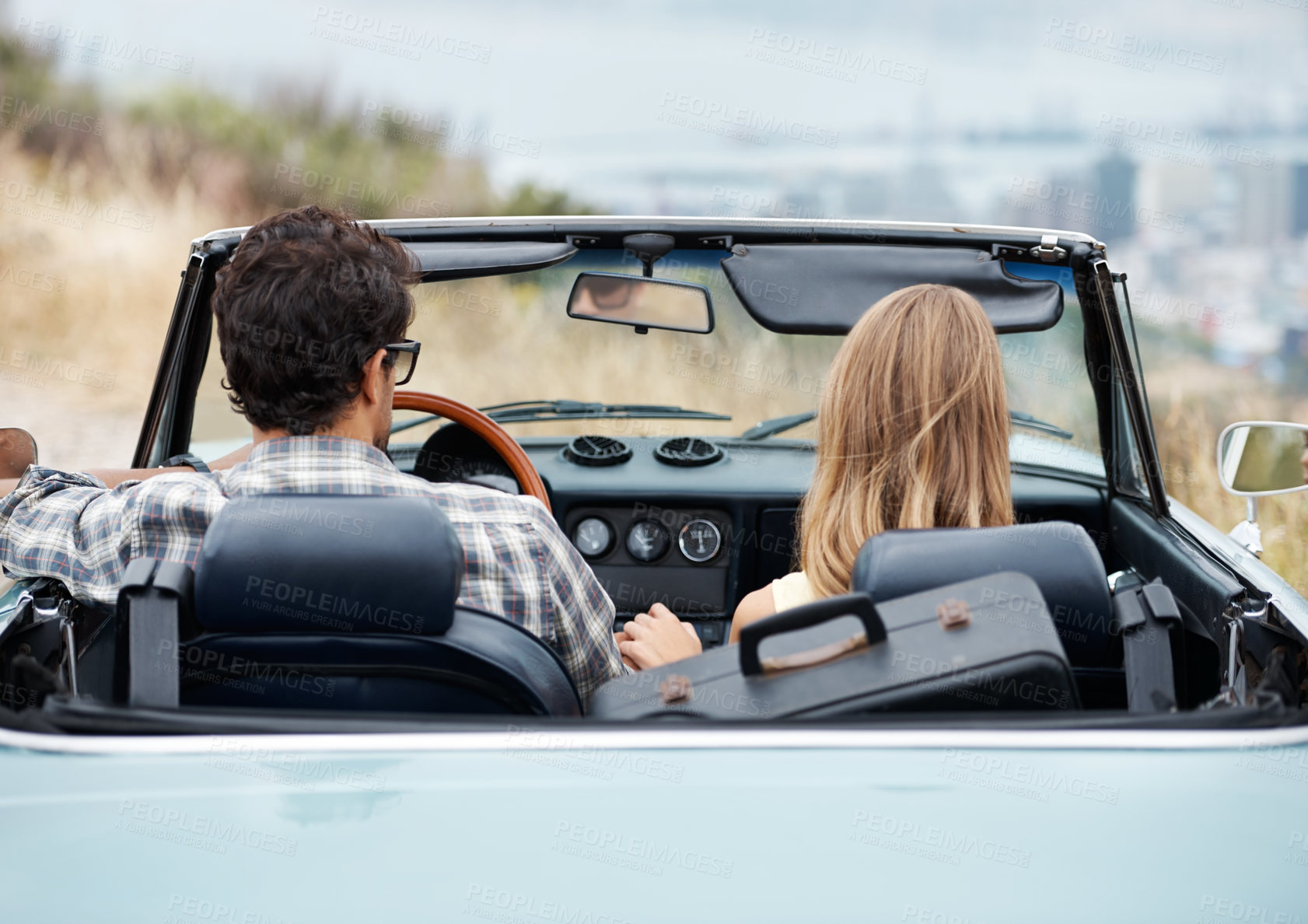 Buy stock photo Road trip, city and couple in car for travel, vacation and adventure for bonding, relax and honeymoon. Holiday destination, dating and man and woman in vehicle for transport, journey and driving