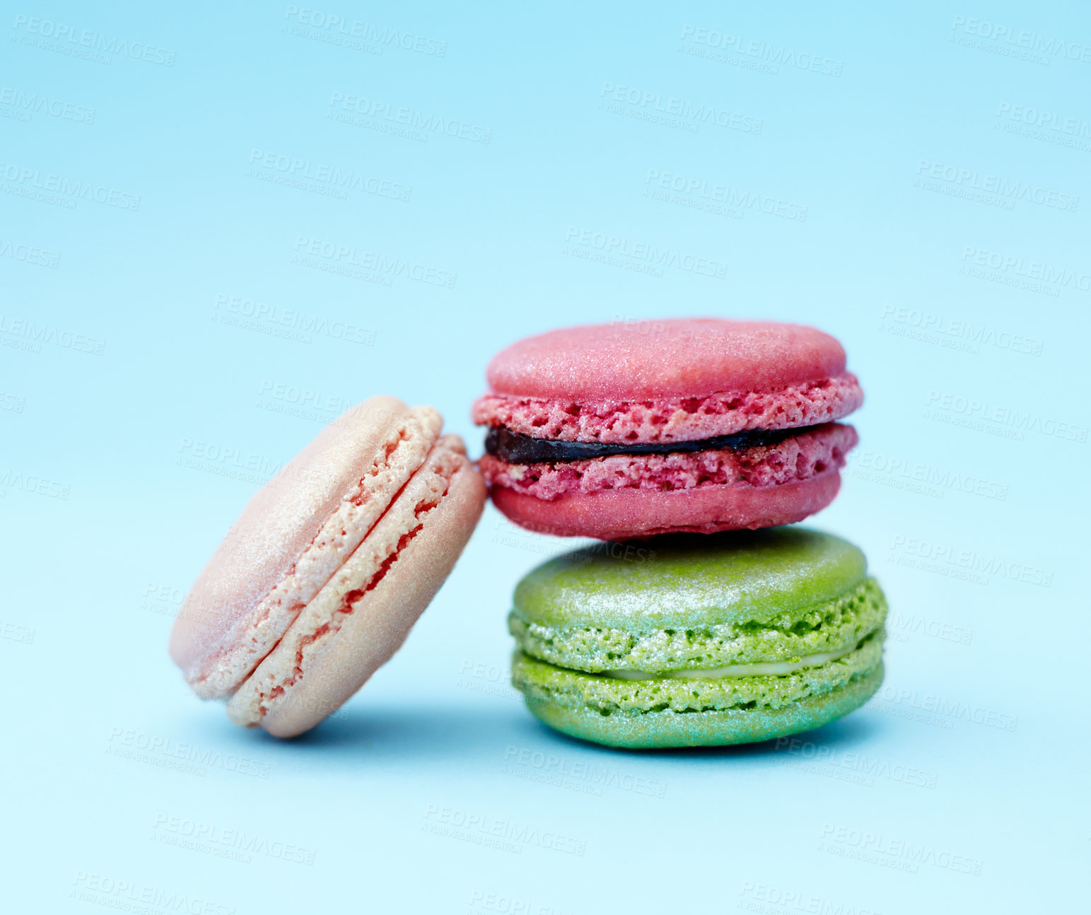 Buy stock photo Baked dessert, candy and stack of French sweets with variety, delicacy and treats on blue background. Macaroons, luxury and different flavors of confectionery for bakery, fine dining and cookies