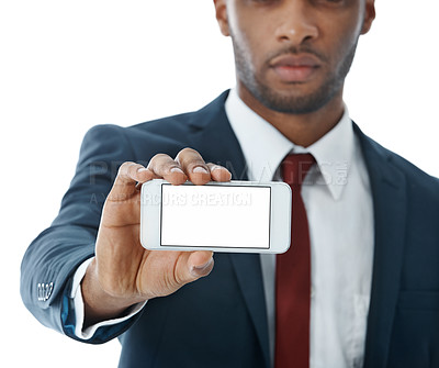 Buy stock photo An african american businessman showing you his smartphone screen while isolated on white
