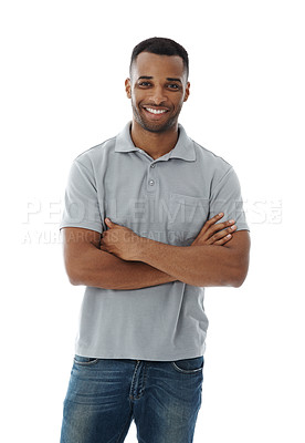 Buy stock photo Portrait of a cool African man smiling with his arms folded, isolated on studio background. Stylish and trendy young male standing in modern or casual clothes and jeans while looking confident