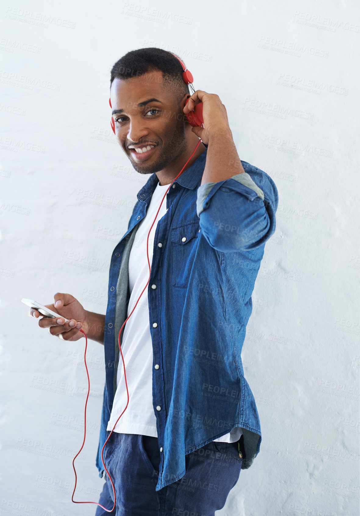 Buy stock photo Black man, portrait and phone for music in studio with radio streaming, audio subscription and listening to sound. African person, face or headphones for ebook app or happy on white background mockup