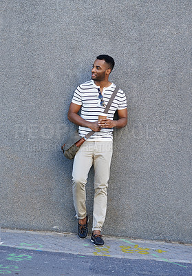 Buy stock photo Happy, travel and creative man with wall background in street for journey to work, coffee and thinking in morning. Male employee, urban and outdoor for commute to designer agency in Los Angeles city.