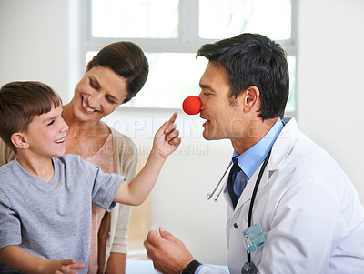 Buy stock photo Playful interaction between a doctor and his patients