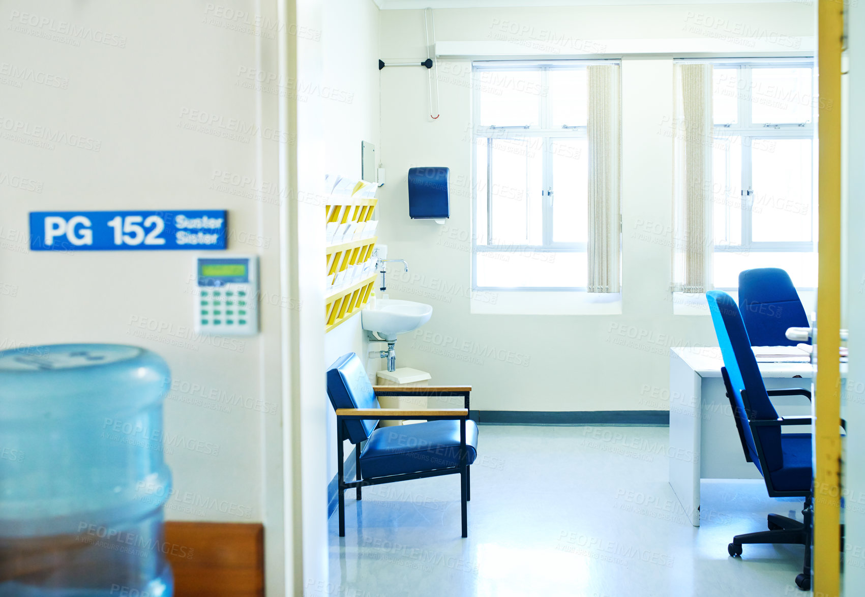 Buy stock photo Hospital, consultation room and interior of doctor office for medical insurance, help or treatment. Chairs, desk and doorway of empty space in clinic for healthcare, checkup service or diagnosis.