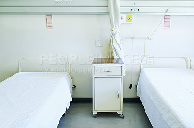 Buy stock photo Interior shot of beds in a hospital ward