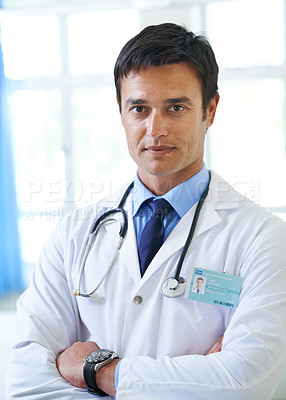 Buy stock photo Portrait, doctor and man with arms crossed, serious and proud for first day in hospital, ambition and expert. Clinic, medical professional and confidence of person, healthcare or lab coat of employee