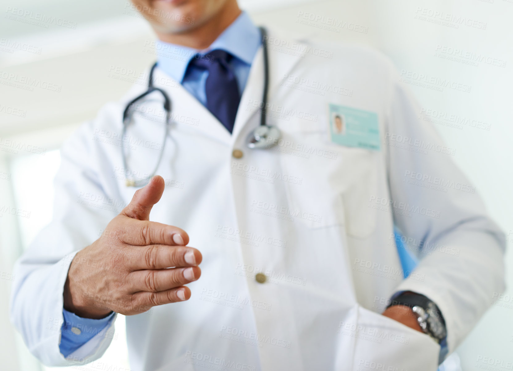 Buy stock photo Doctor, handshake and greeting gesture in hospital, man and welcome introduction for patient consultation. Clinic, professional and friendly man or healthcare employee, respect and trust for checkup